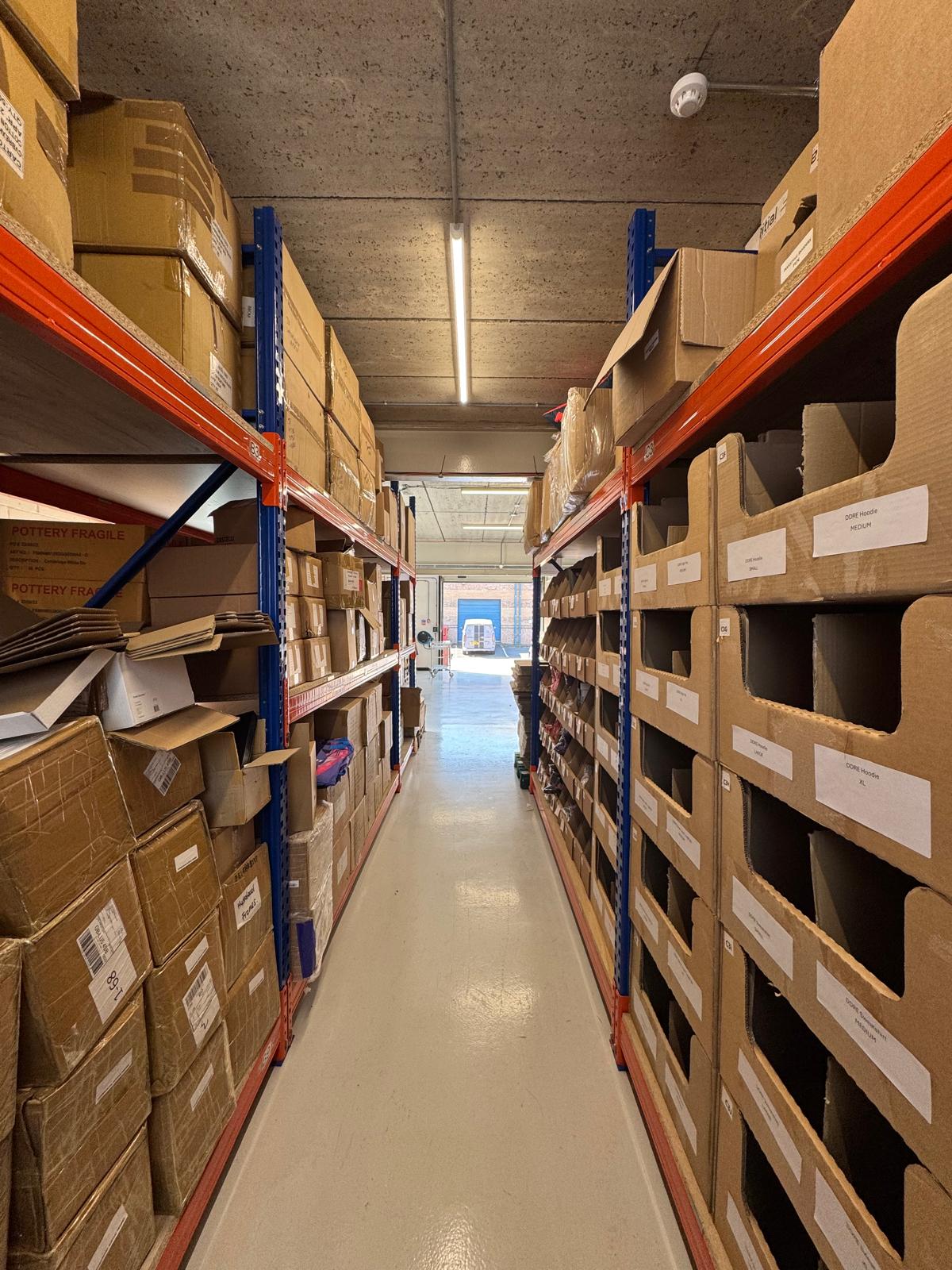 inside a company warehouse where they store branded merchandise which can be packed and sent out globally.