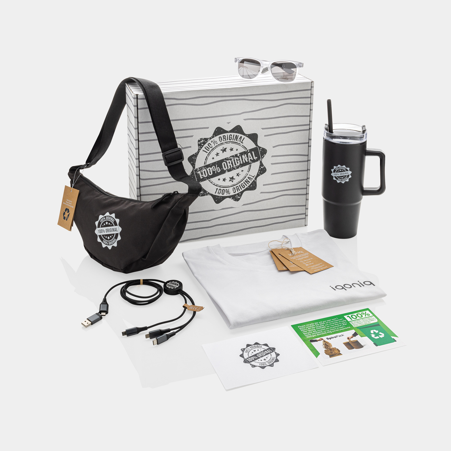 Branded staff welcome packs filled with various promotional items, including: personalised tech accessories, a printed bag, an engraved flask and an embroidered t-shirt.