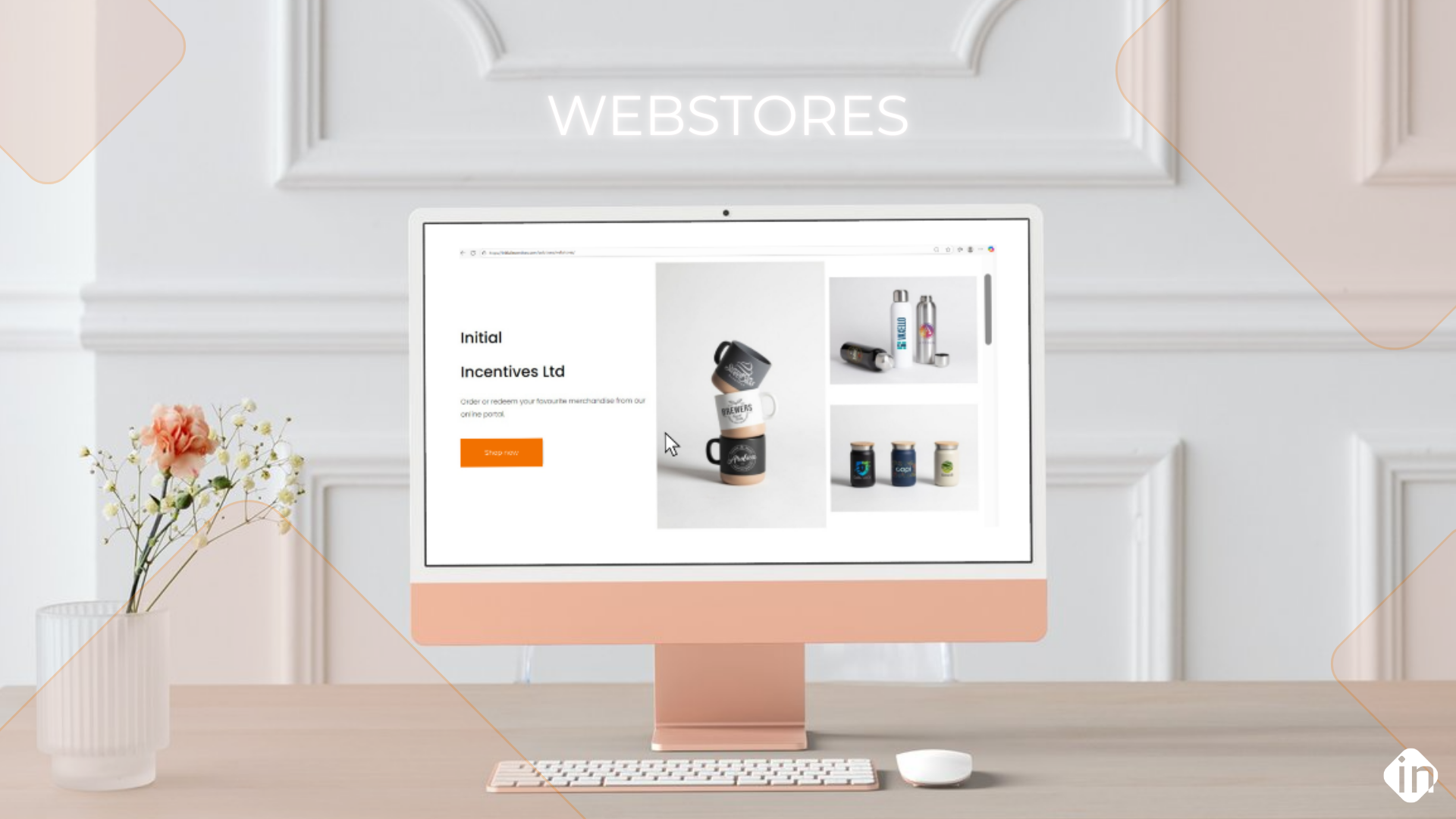 Desktop computer displaying a branded merchandise webstore with custom mugs, bottles, and jars.